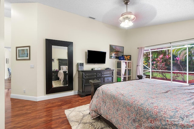 7884 Travlers Tree Dr, Boca Raton, FL 33433 - bedroom featuring wood finished floors, baseboards, a textured ceiling, and ceiling fan