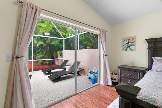 7884 Travlers Tree Dr, Boca Raton, FL 33433 - bedroom featuring wood finished floors, lofted ceiling, and access to exterior