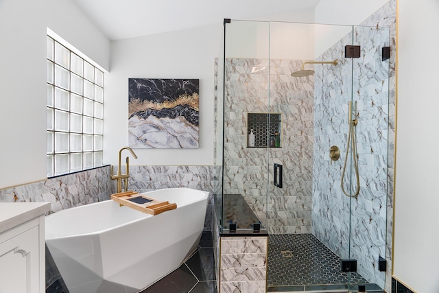 7884 Travlers Tree Dr, Boca Raton, FL 33433 - bathroom with tile walls, a freestanding tub, a shower stall, vanity, and wainscoting