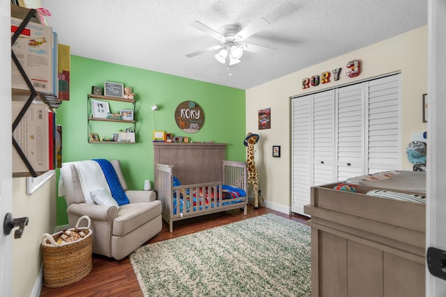 7884 Travlers Tree Dr, Boca Raton, FL 33433 - bedroom with wood finished floors, a textured ceiling, a closet, a ceiling fan, and baseboards
