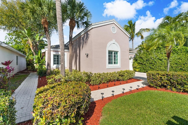 7884 Travlers Tree Dr, Boca Raton, FL 33433 - view of front of house with stucco siding and a front lawn