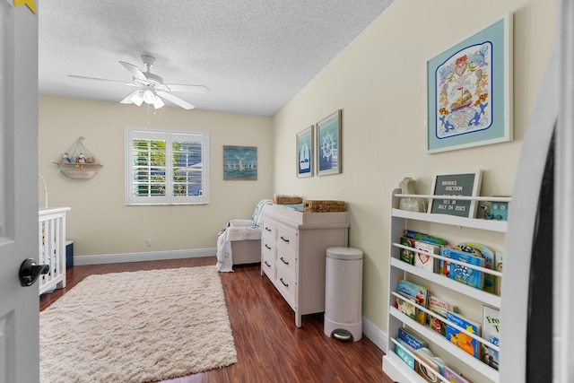 7884 Travlers Tree Dr, Boca Raton, FL 33433 - bedroom with dark wood-type flooring, a textured ceiling, baseboards, and ceiling fan