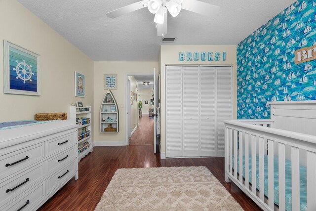 7884 Travlers Tree Dr, Boca Raton, FL 33433 - bedroom with dark wood-type flooring, a closet, a textured ceiling, baseboards, and a ceiling fan