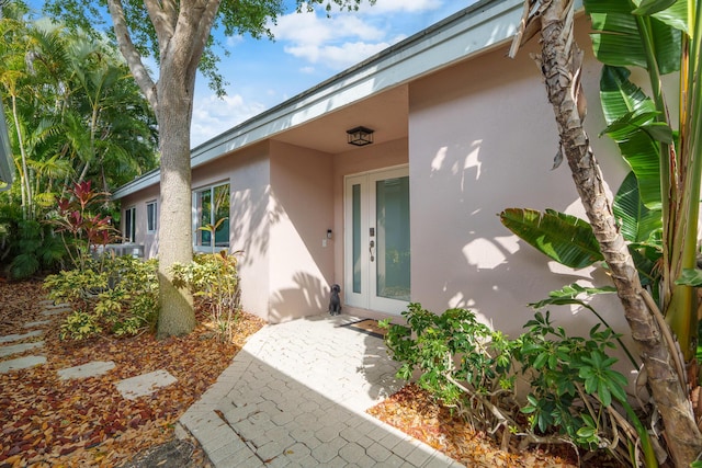 7884 Travlers Tree Dr, Boca Raton, FL 33433 - property entrance featuring stucco siding and french doors