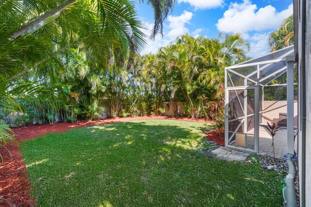 7884 Travlers Tree Dr, Boca Raton, FL 33433 - view of yard featuring a lanai
