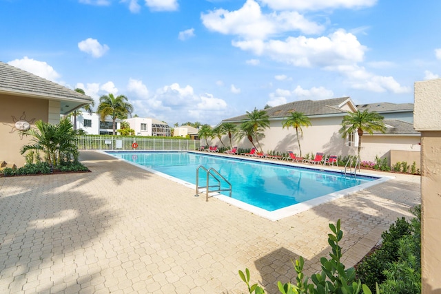7884 Travlers Tree Dr, Boca Raton, FL 33433 - community pool featuring a patio area and a residential view