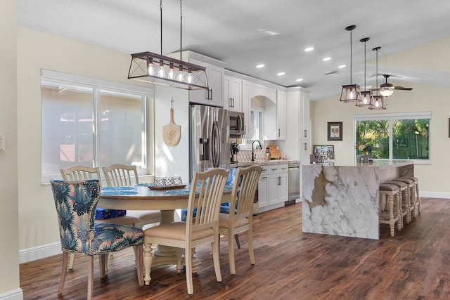 7884 Travlers Tree Dr, Boca Raton, FL 33433 - dining space with recessed lighting, dark wood finished floors, baseboards, and arched walkways