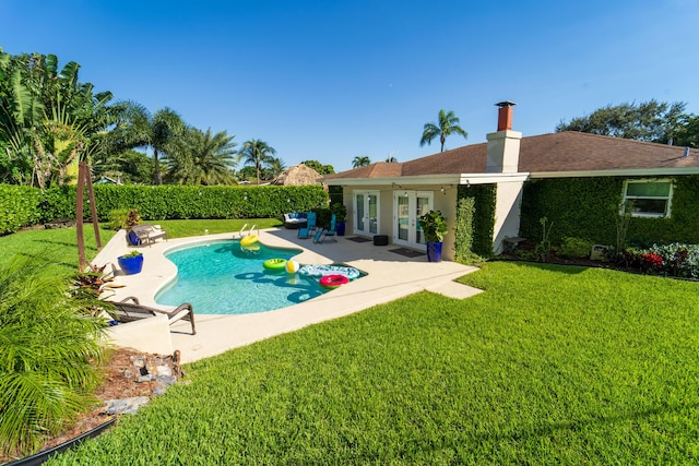 view of pool featuring french doors and a patio
