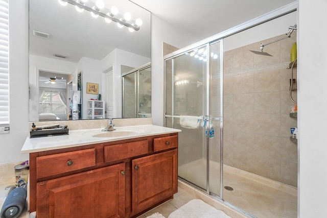 full bathroom featuring a stall shower, ensuite bath, vanity, and ceiling fan