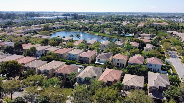 aerial perspective of suburban area featuring a nearby body of water