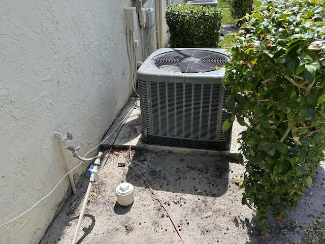 4393 Woodstock Dr Unit C, West Palm Beach, FL 33409 - exterior view of cooling unit and stucco siding