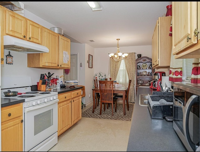4257 36th Ct, Vero Beach, FL 32967 - kitchen with under cabinet range hood, electric stove, stainless steel microwave, a chandelier, and dark countertops
