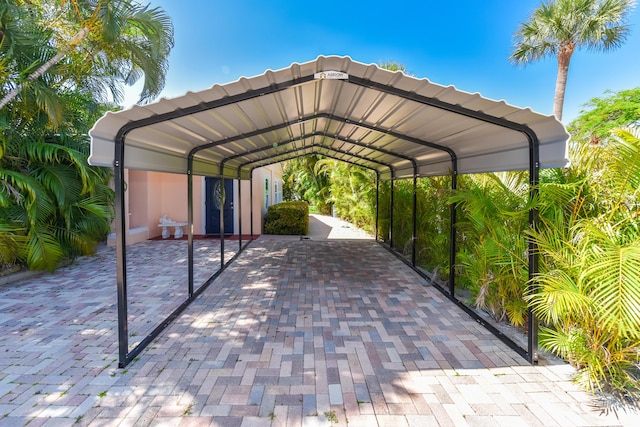 1116 NE Oceanview Cir, Jensen Beach, FL 34957 - view of parking with a detached carport