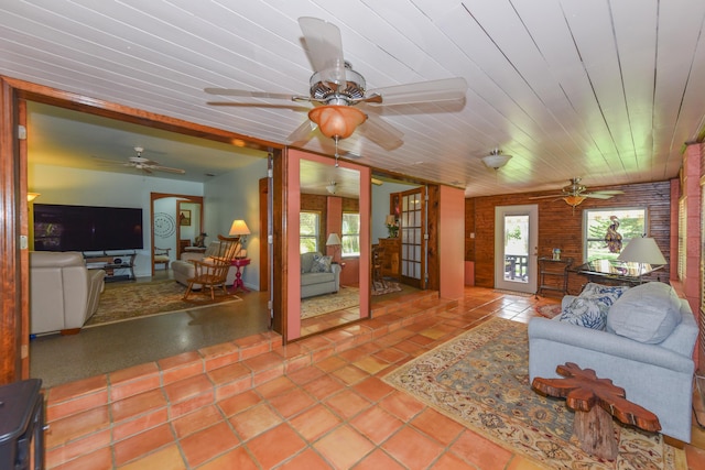 1116 NE Oceanview Cir, Jensen Beach, FL 34957 - tiled living room featuring ceiling fan and wooden ceiling