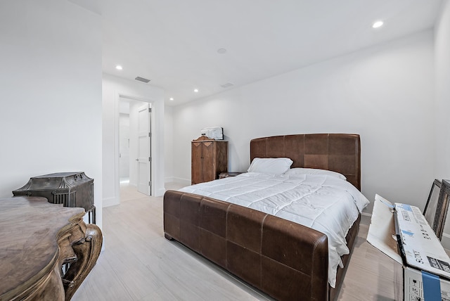 bedroom featuring recessed lighting, light wood finished floors, and baseboards