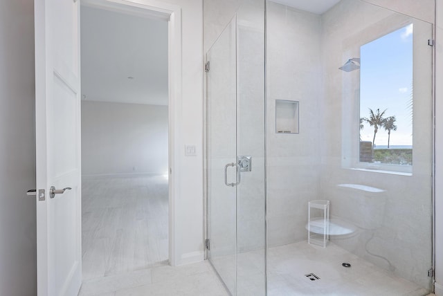 bathroom with a shower stall