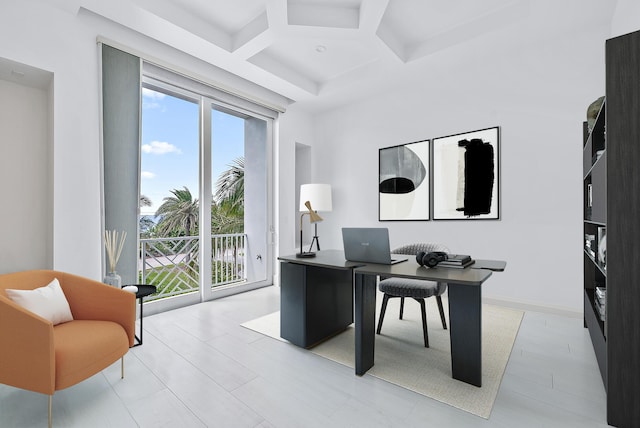 office featuring coffered ceiling, plenty of natural light, and beamed ceiling