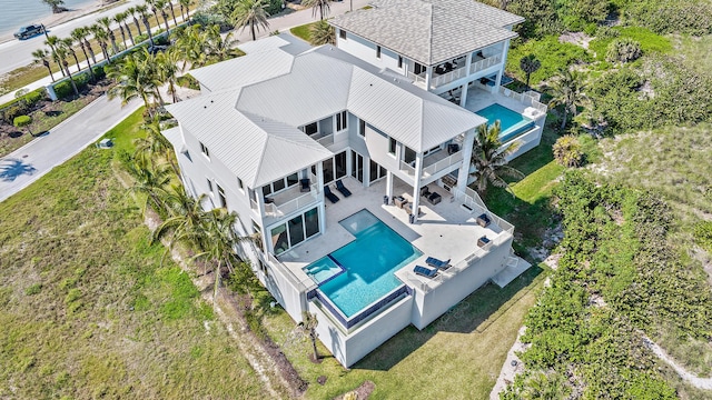 view of subject property with a pool