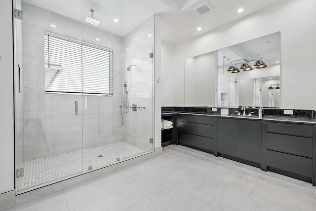 bathroom featuring vanity, a shower stall, and recessed lighting