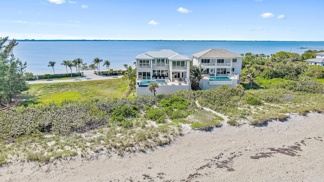view of subject property with a nearby body of water