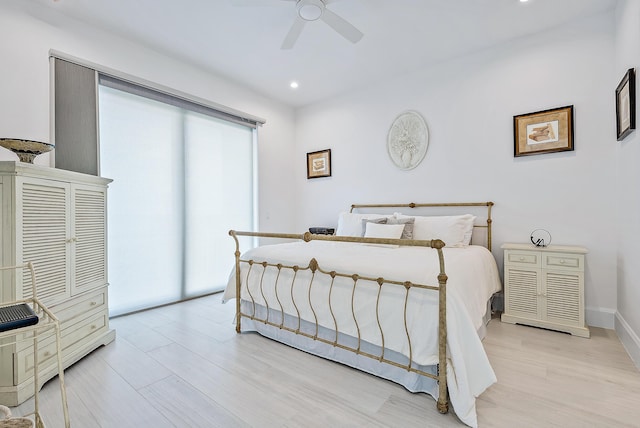 bedroom with light wood-style flooring, a ceiling fan, baseboards, and recessed lighting