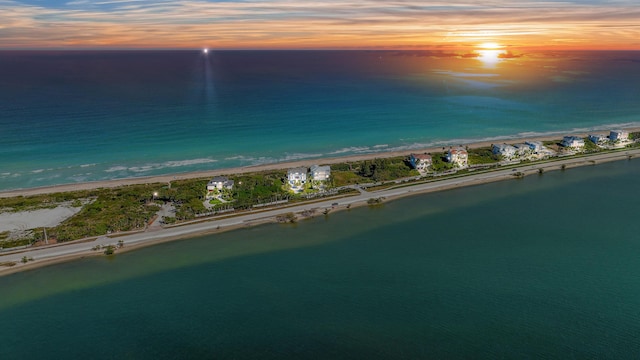 aerial view at dusk of view of water and beach
