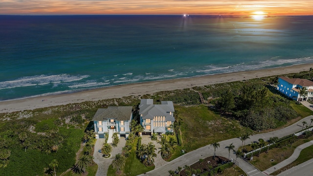 aerial view at dusk of view of water and beach