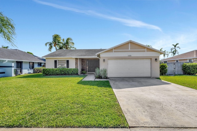 1181 Larch Way, Wellington, FL 33414 - view of front of home with a garage, concrete driveway, and stucco siding