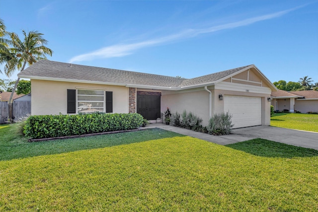 1181 Larch Way, Wellington, FL 33414 - view of front of home featuring stucco siding, an attached garage, concrete driveway, and a shingled roof