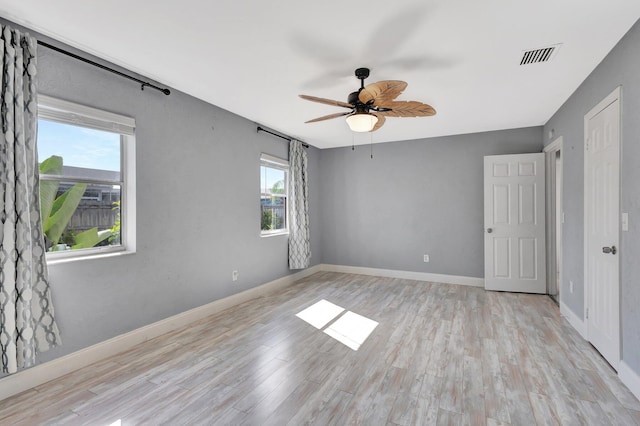 1181 Larch Way, Wellington, FL 33414 - spare room with plenty of natural light, ceiling fan, and light wood-type flooring