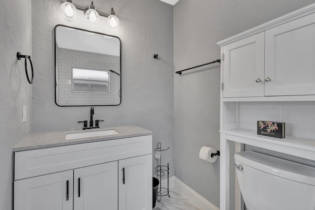 1181 Larch Way, Wellington, FL 33414 - bathroom with toilet, marble look tiles, vanity, and baseboards