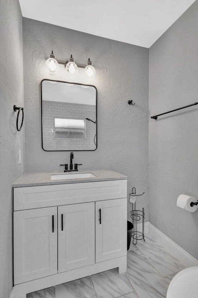 1181 Larch Way, Wellington, FL 33414 - bathroom with marble look tiles, vanity, and toilet