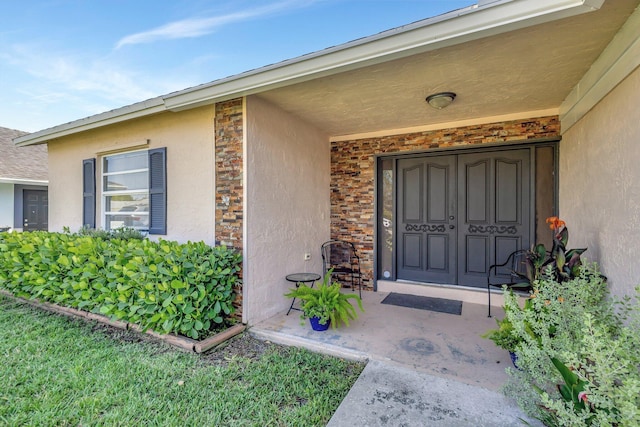 1181 Larch Way, Wellington, FL 33414 - view of exterior entry featuring stucco siding