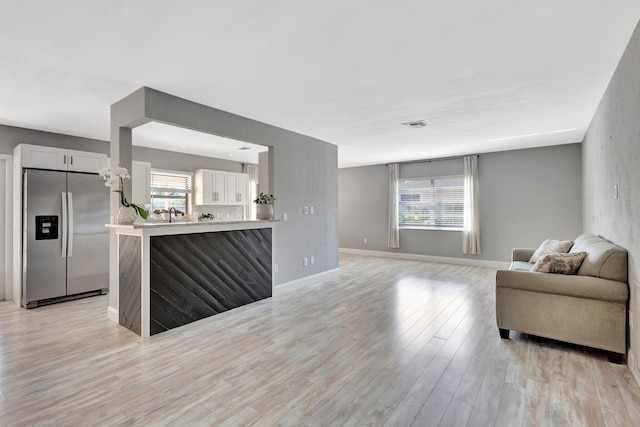 1181 Larch Way, Wellington, FL 33414 - living area featuring light wood-style flooring and baseboards