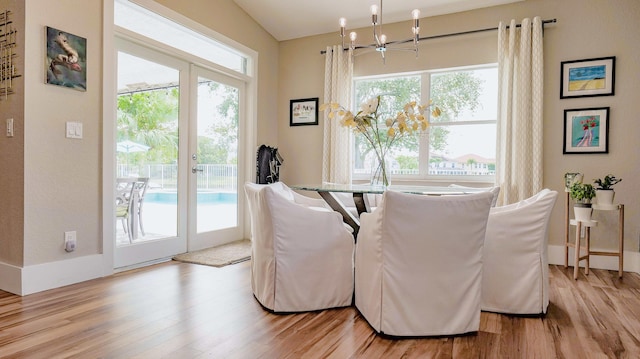 7340 Anadale Cir, Lake Worth, FL 33467 - dining area featuring a chandelier and light wood finished floors