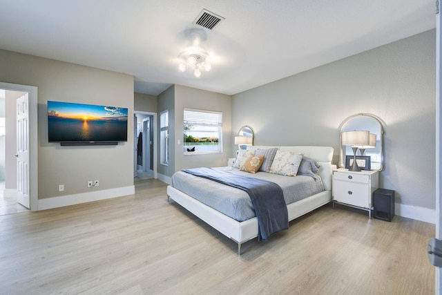 7340 Anadale Cir, Lake Worth, FL 33467 - bedroom featuring light wood finished floors and baseboards