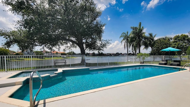 7340 Anadale Cir, Lake Worth, FL 33467 - view of pool featuring a pool with connected hot tub and a patio