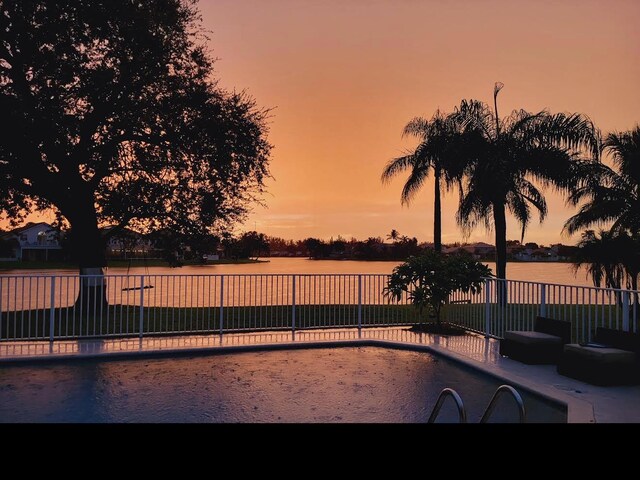7340 Anadale Cir, Lake Worth, FL 33467 - view of swimming pool with a water view