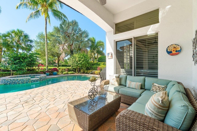 view of swimming pool with an outdoor living space, a patio, and a pool with connected hot tub
