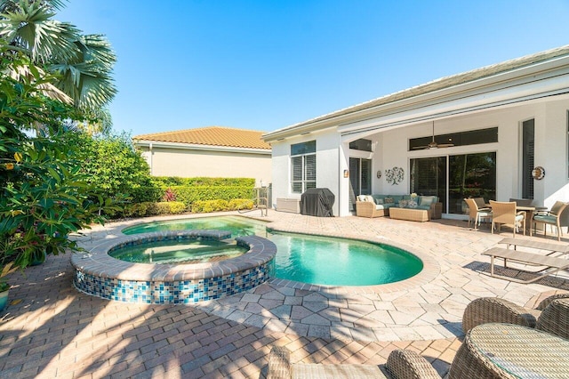 view of pool with outdoor lounge area, a ceiling fan, a patio area, a pool with connected hot tub, and outdoor dining area