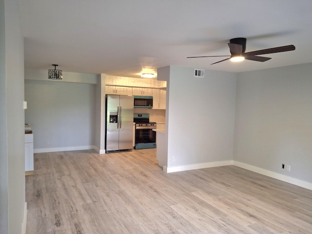 6515 Chasewood Dr Unit D, Jupiter, FL 33458 - unfurnished living room with ceiling fan, light wood-style floors, and baseboards