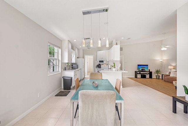 10853 SW Elsinore Dr, Port Saint Lucie, FL 34987 - dining room featuring a ceiling fan, light tile patterned floors, baseboards, and recessed lighting