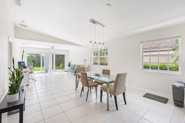10853 SW Elsinore Dr, Port Saint Lucie, FL 34987 - dining space featuring vaulted ceiling, light tile patterned floors, a ceiling fan, and baseboards