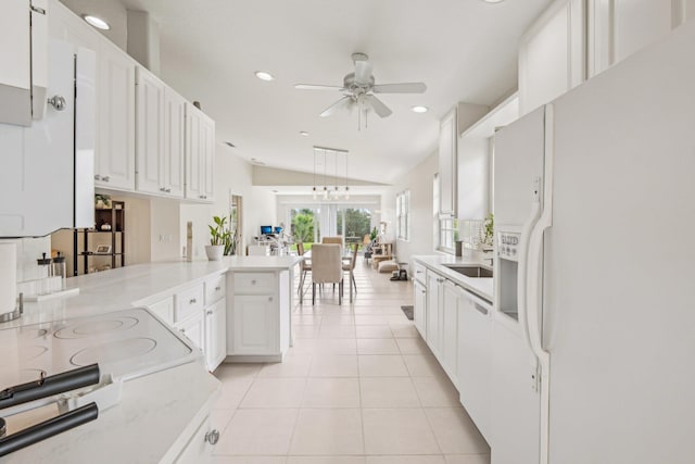 10853 SW Elsinore Dr, Port Saint Lucie, FL 34987 - kitchen featuring white fridge with ice dispenser, a ceiling fan, a peninsula, recessed lighting, and light tile patterned floors