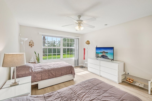 10853 SW Elsinore Dr, Port Saint Lucie, FL 34987 - bedroom featuring wood finished floors, baseboards, and ceiling fan