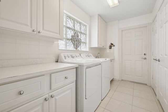 10853 SW Elsinore Dr, Port Saint Lucie, FL 34987 - laundry room featuring cabinet space, separate washer and dryer, and light tile patterned floors