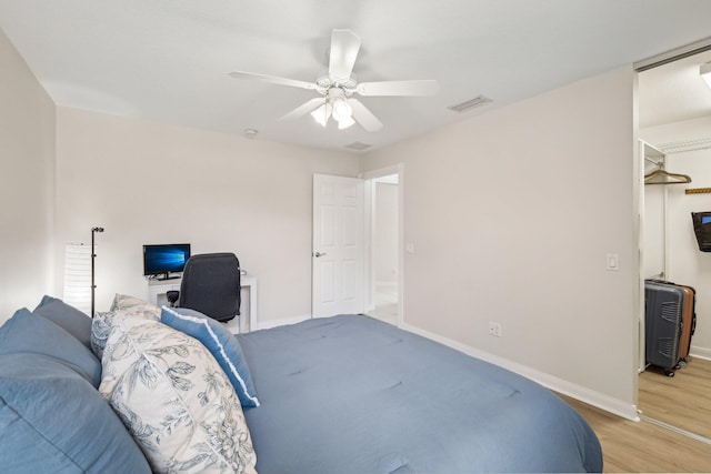 10853 SW Elsinore Dr, Port Saint Lucie, FL 34987 - bedroom featuring baseboards, light wood-type flooring, and ceiling fan