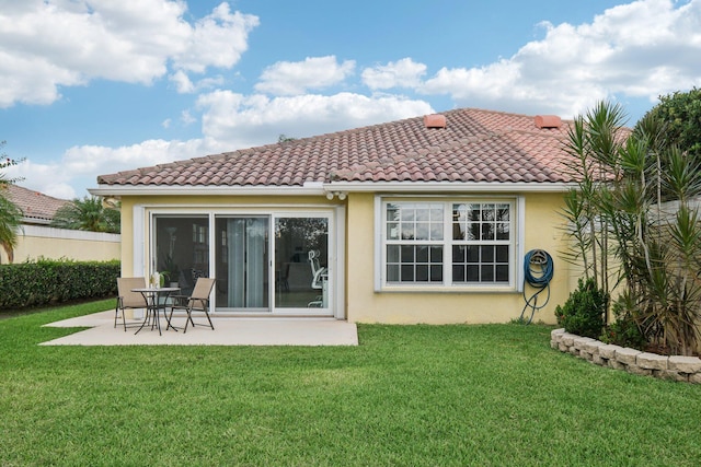 10853 SW Elsinore Dr, Port Saint Lucie, FL 34987 - rear view of house featuring stucco siding, a patio area, and a tiled roof
