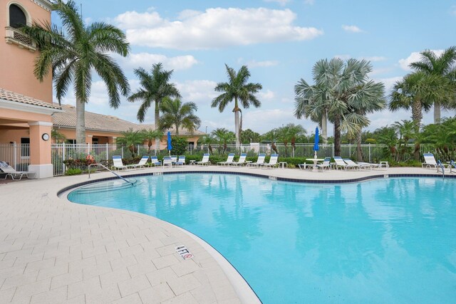 10853 SW Elsinore Dr, Port Saint Lucie, FL 34987 - community pool featuring a patio