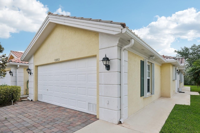 10853 SW Elsinore Dr, Port Saint Lucie, FL 34987 - garage featuring driveway